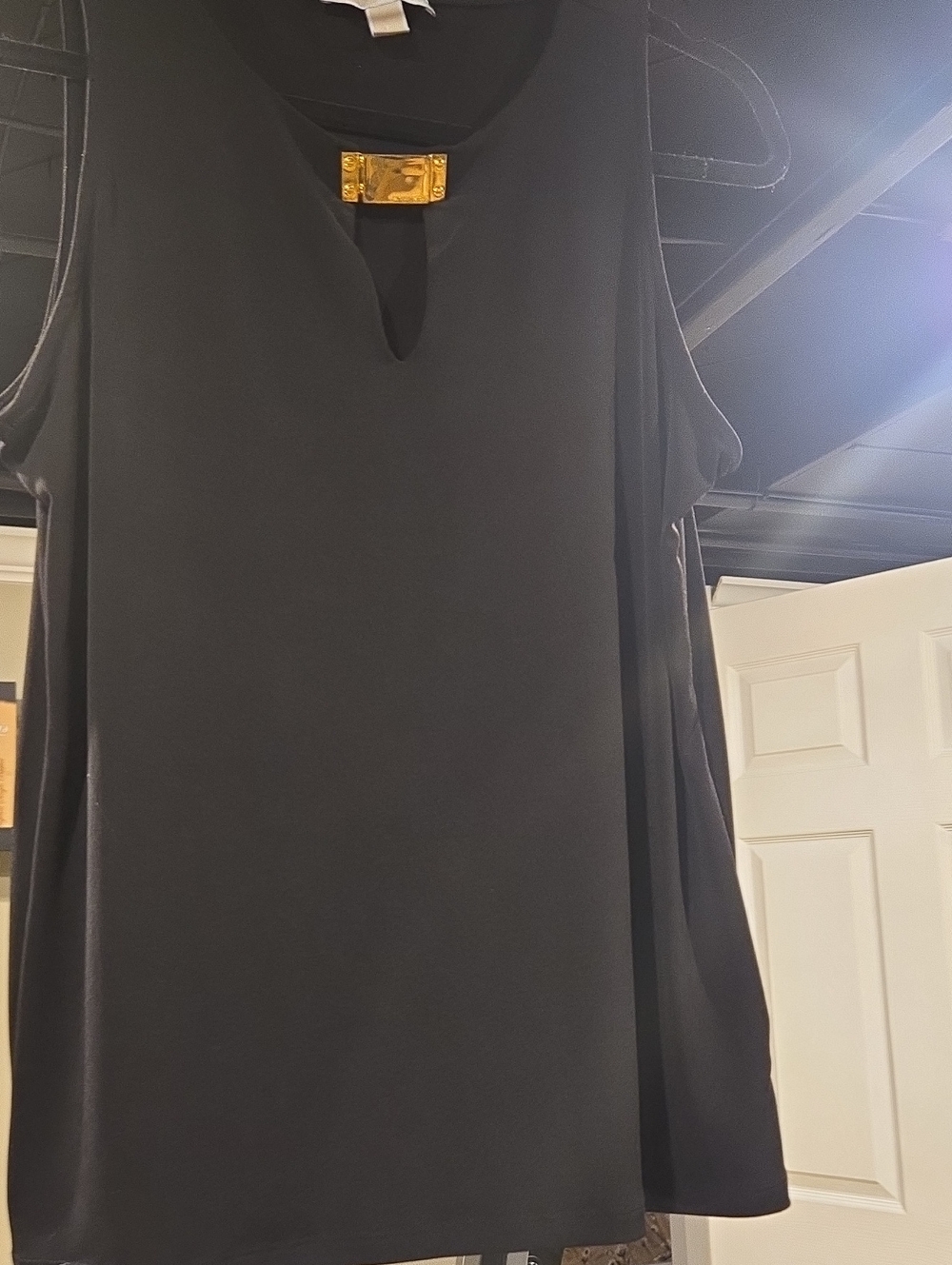 Black Sleeveless Top with Gold Accent